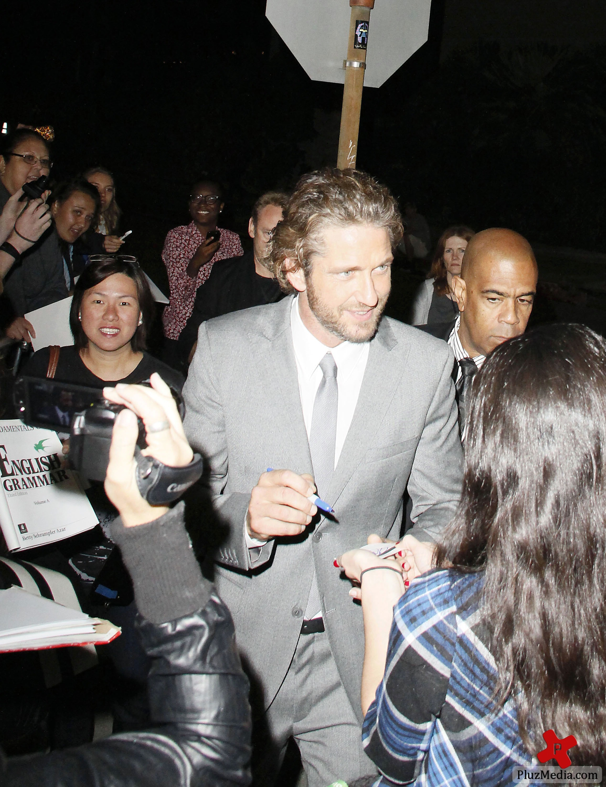 Gerard Butler signs autographs for fans at the 'Machine Gun Preacher' premiere | Picture 84228